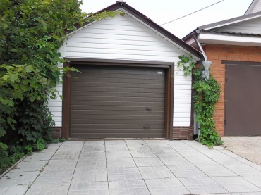 Утепленные ворота для гаража с автоматическим приводом
